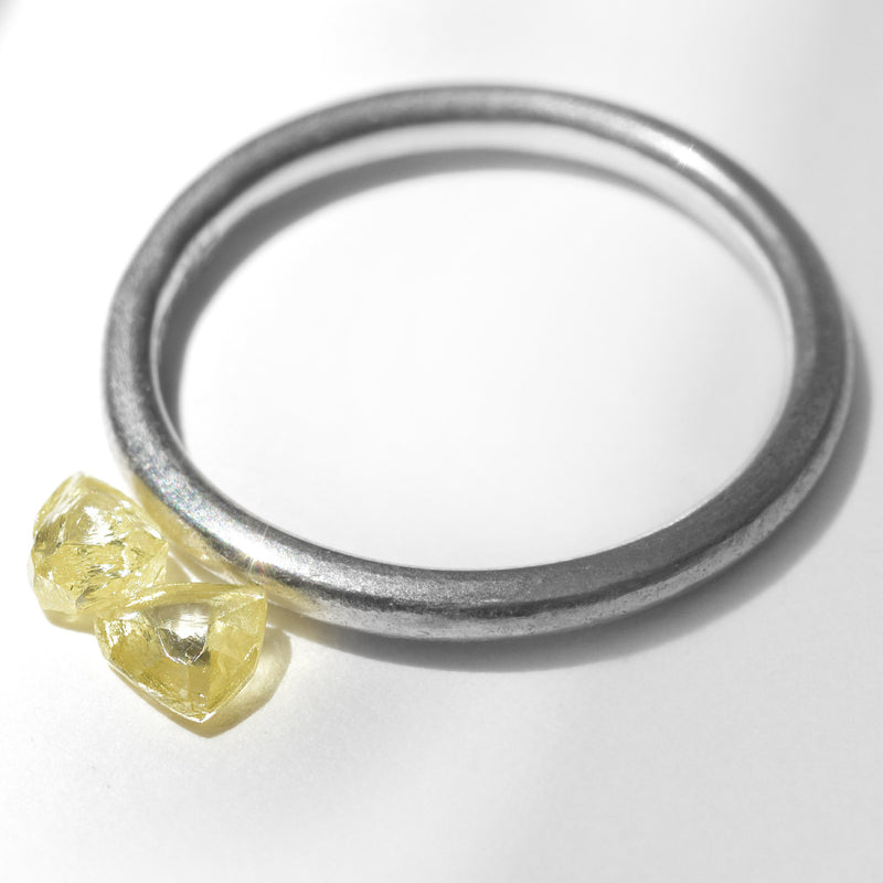 0.44 carat fancy yellow triangular rough diamond pair