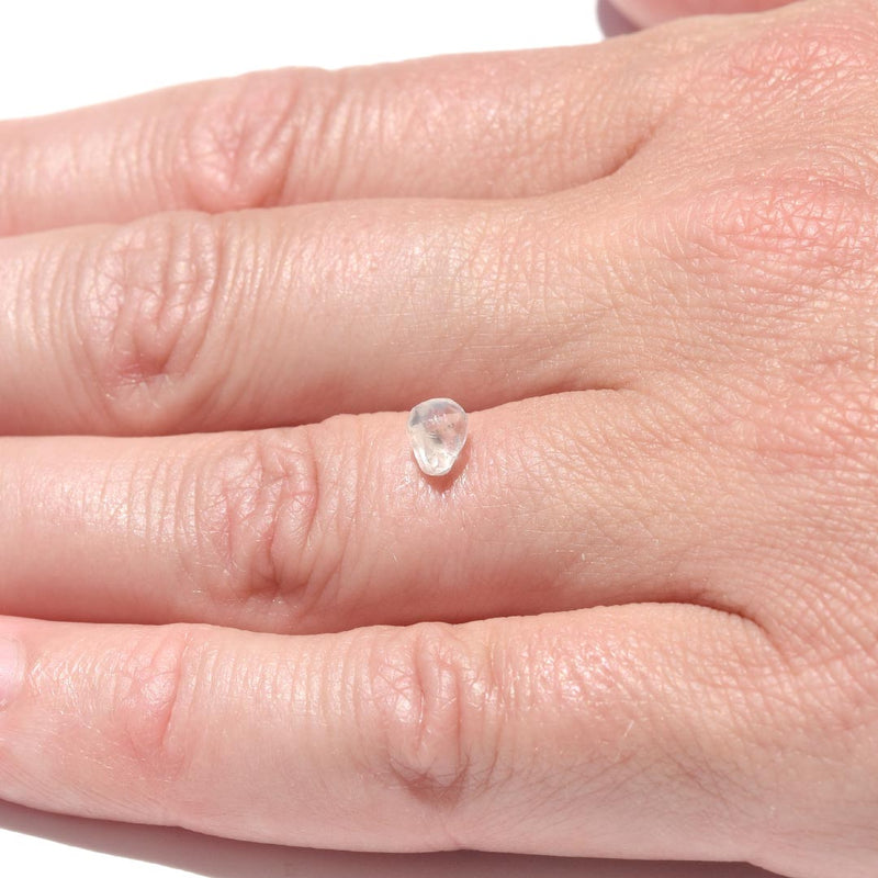 0.72 carat matte white freeform shaped raw diamond