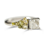Raw diamond with side clustered green spectrum raw diamonds in white gold
