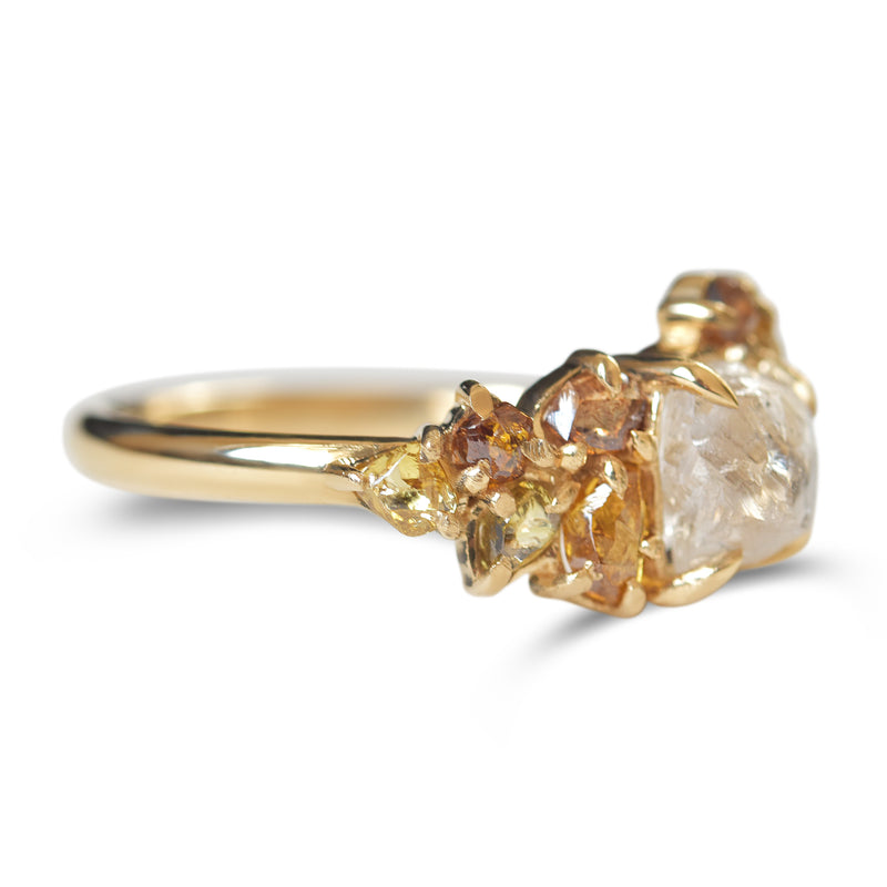 Raw diamond with clustered golden raw diamonds in yellow gold