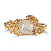 Raw diamond with clustered golden raw diamonds in yellow gold