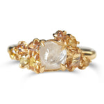 Raw diamond with clustered golden raw diamonds in yellow gold
