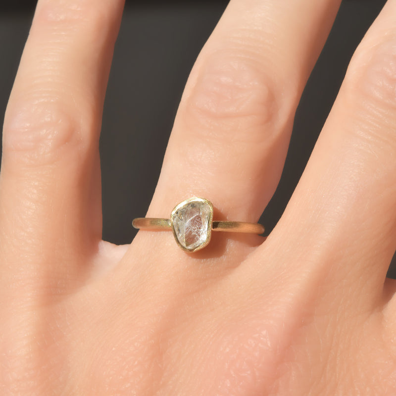 Brushed bezel raw diamond ring with 1.2 carat rough diamond in 14k yellow gold