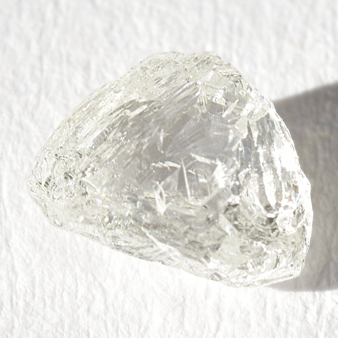 1.21 carat white and glowy triangular raw diamond