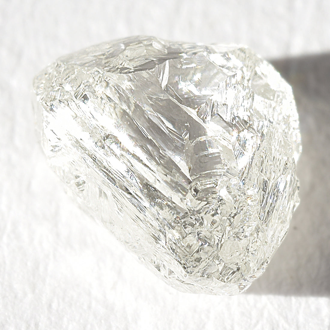 1.21 carat white and glowy triangular raw diamond