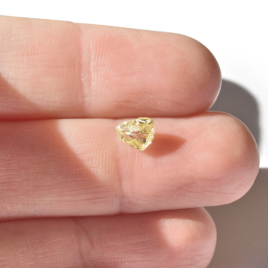 0.71 carat sunshiney raw diamond triangle