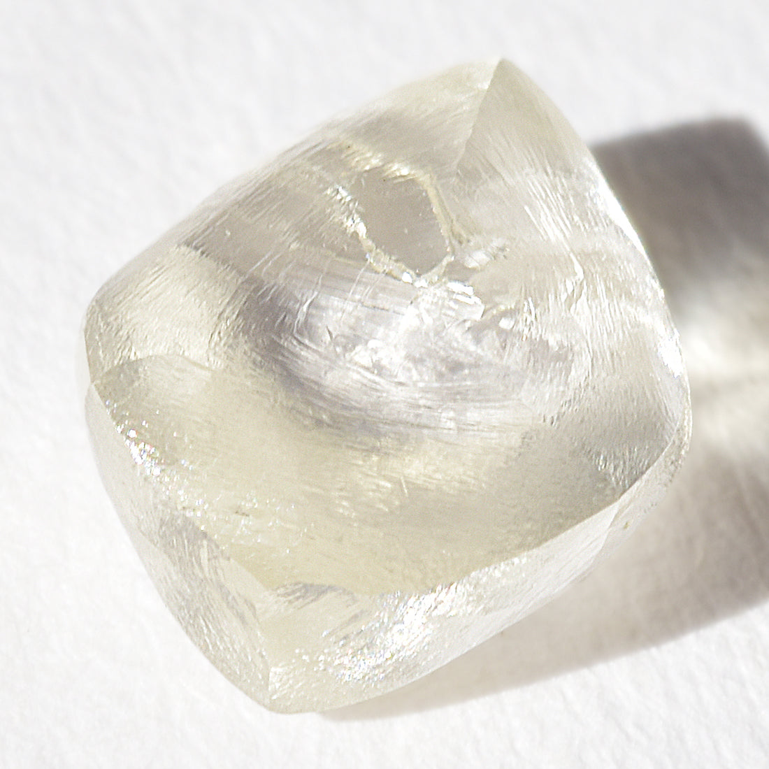 1.44 carat light champagne rhombododecahedral raw diamond