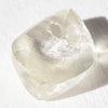 1.44 carat light champagne rhombododecahedral raw diamond