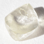 1.44 carat light champagne rhombododecahedral raw diamond