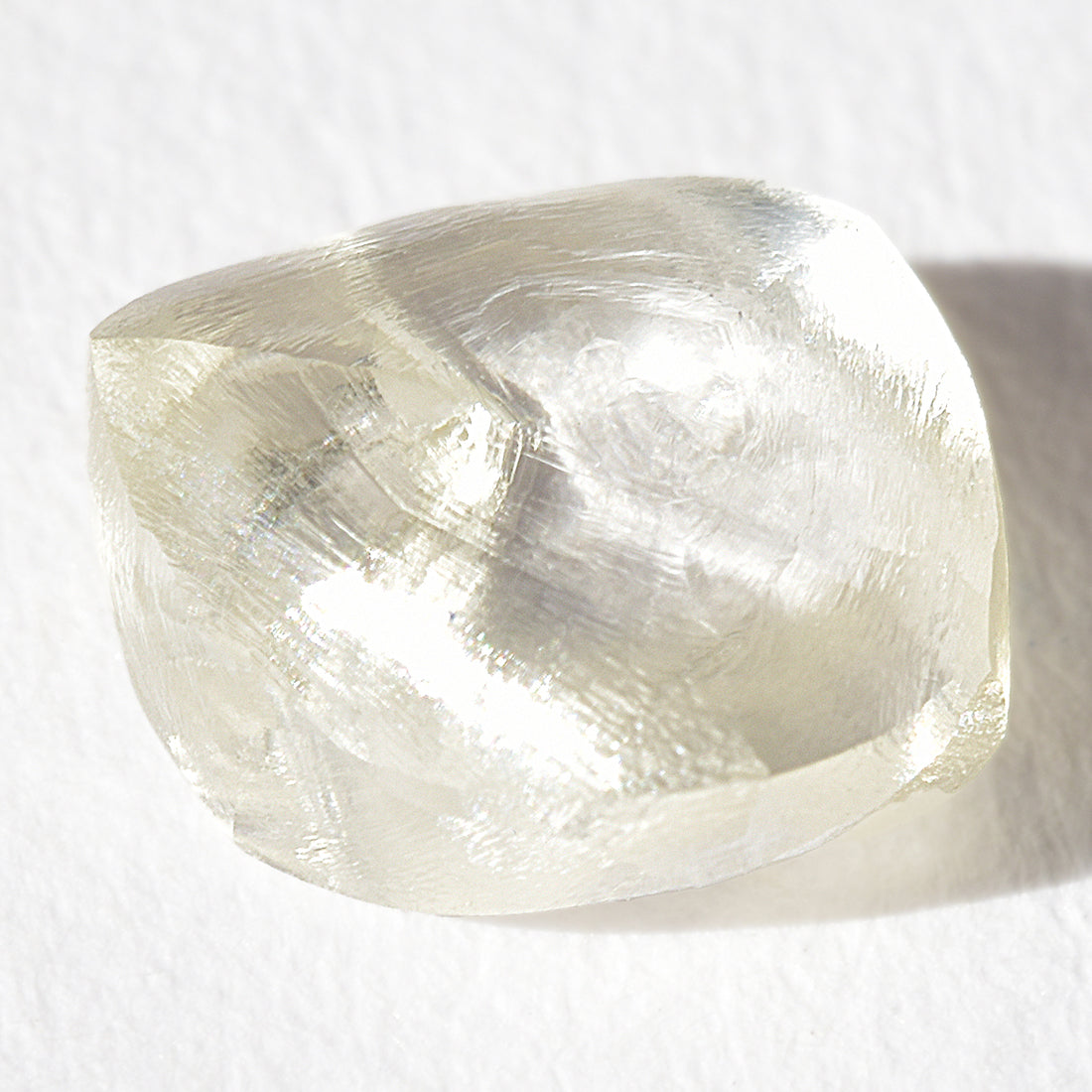 1.44 carat light champagne rhombododecahedral raw diamond