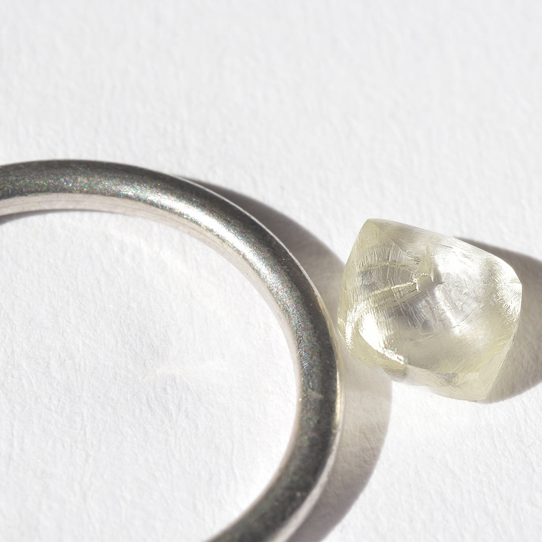 1.44 carat light champagne rhombododecahedral raw diamond