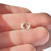 1.44 carat light champagne rhombododecahedral raw diamond