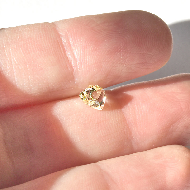 0.71 carat clean and clear macle raw diamond