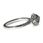 Black raw diamond engagement ring from sideview