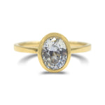 Ethereal white sapphire bezel set ring in 14k yellow gold
