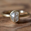 Brushed bezel raw diamond ring with 1.2 carat rough diamond in 14k yellow gold