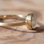 Brushed bezel raw diamond ring with 1.2 carat rough diamond in 14k yellow gold