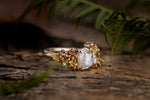 Raw diamond with clustered golden raw diamonds in yellow gold