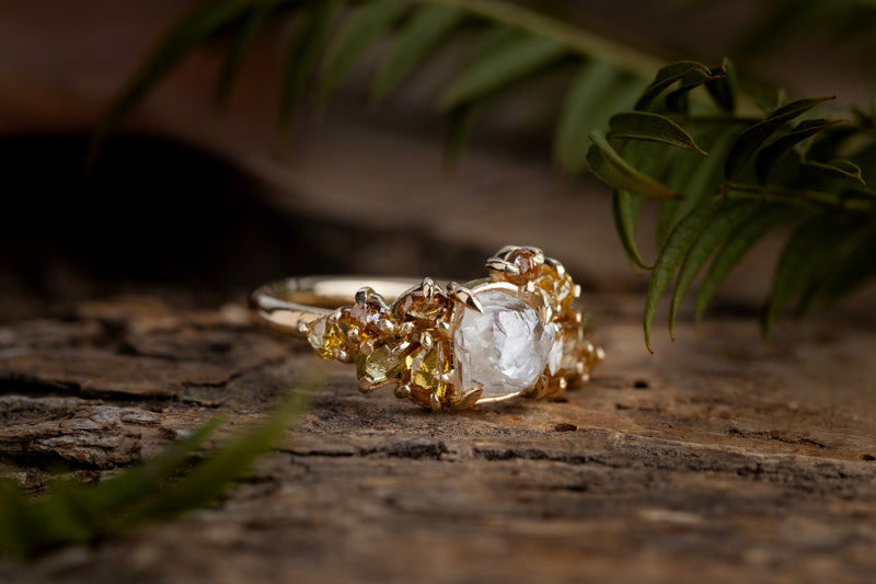 Raw diamond with clustered golden raw diamonds in yellow gold