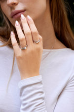 Rough diamond cluster ring with octahedral raw diamond and raw diamond cluster paired with a sterling silver twisted band and unique infinity ring
