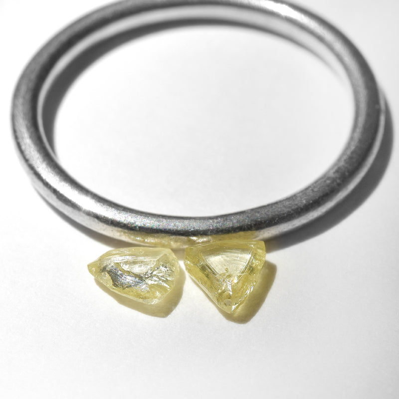 0.48 carat fancy yellow triangular rough diamond pair