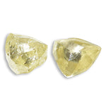 0.44 carat fancy yellow triangular rough diamond pair