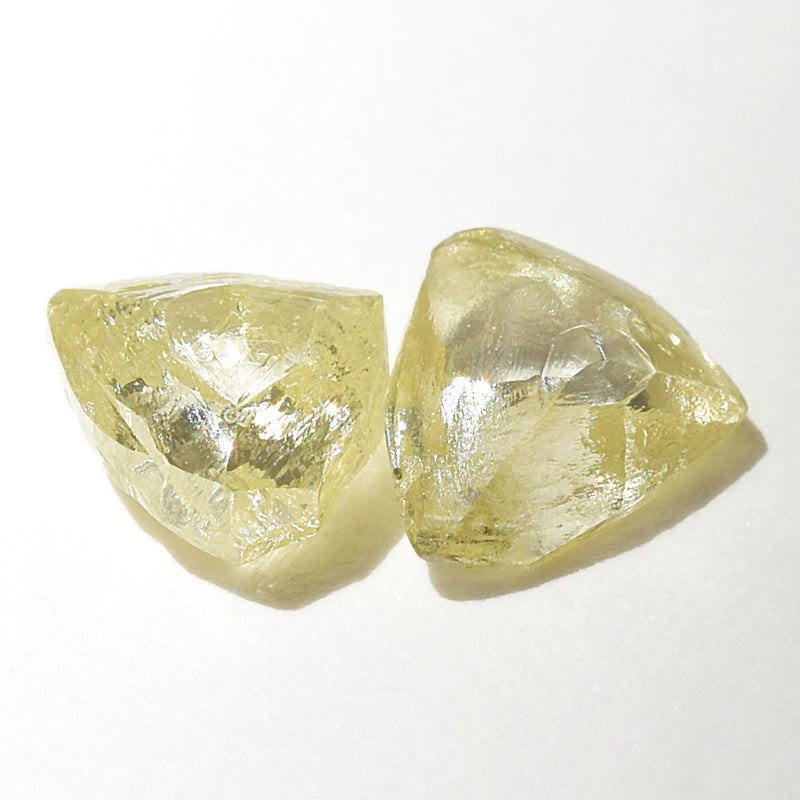 0.44 carat fancy yellow triangular rough diamond pair