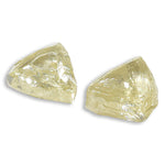 0.59 carat fancy yellow triangular rough diamond pair
