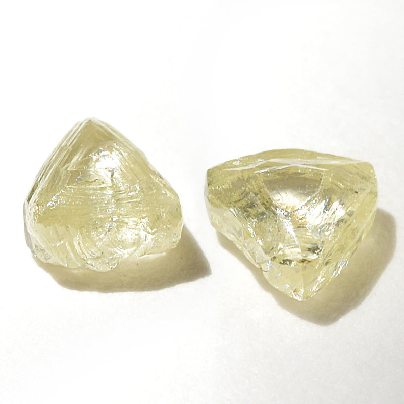 0.59 carat fancy yellow triangular rough diamond pair