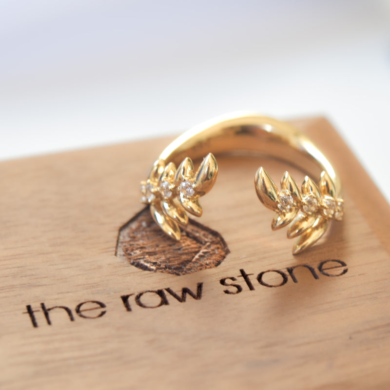 Leaf themed band with white sapphires