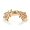 Wing themed band in 14k yellow gold with 8 white sapphires