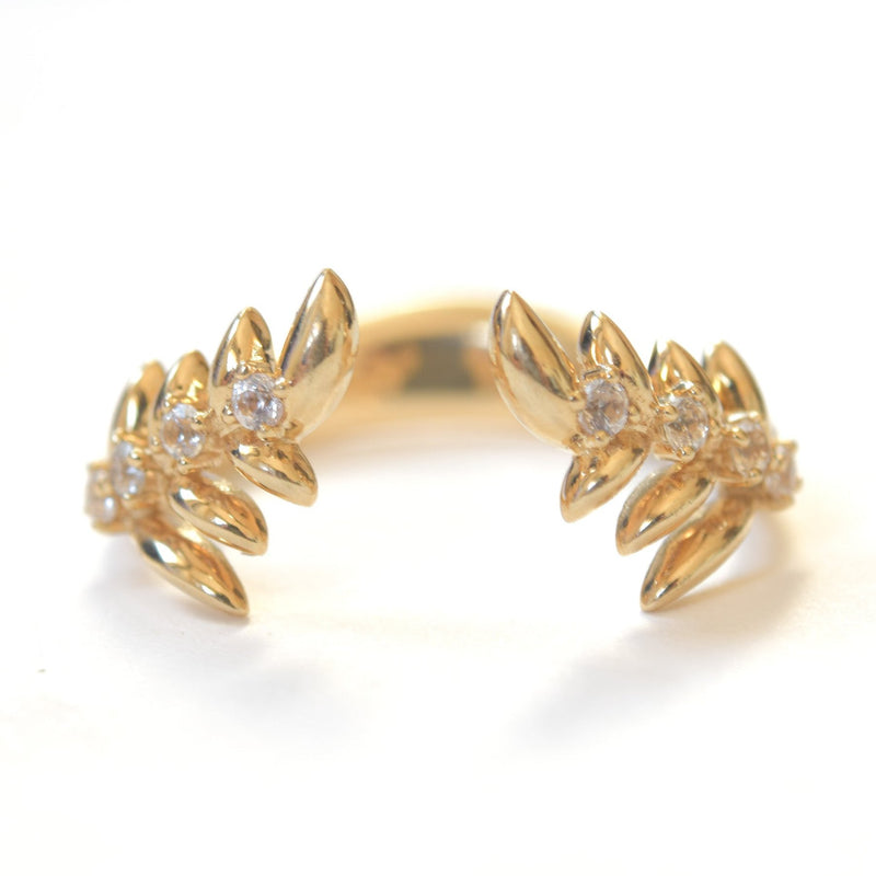 Wing themed band in 14k yellow gold with 8 white sapphires