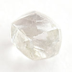 0.74 carat waterlike and gemmy raw diamond rhombododecahedron