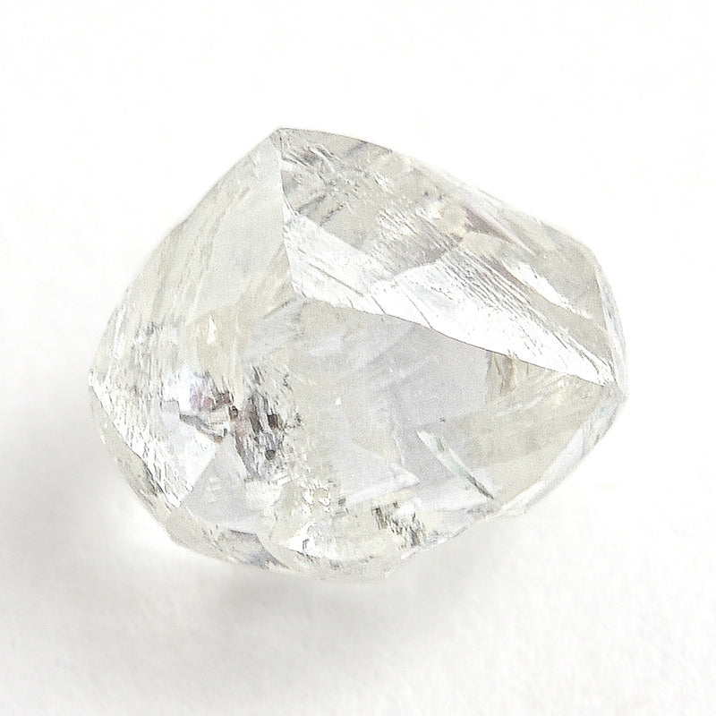 0.90 carat smooth and white raw diamond dodecahedron