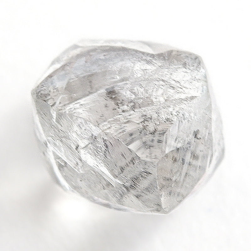 0.90 carat silver and white internal raw diamond dodecahedron