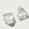 0.72 carat silver white raw diamond octahedron pair