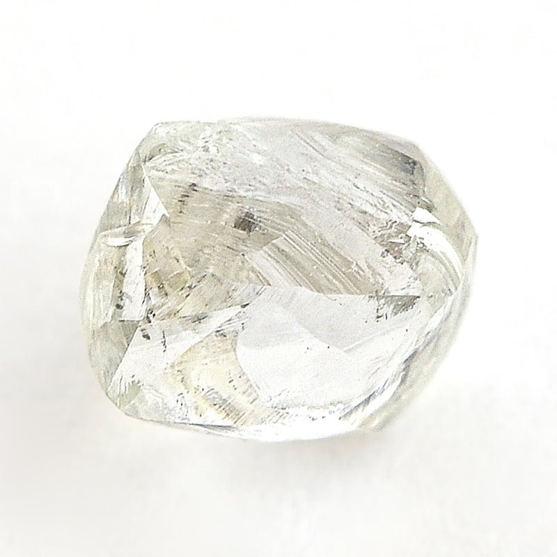 1.06 carat white and waterlike raw diamond dodecahedron