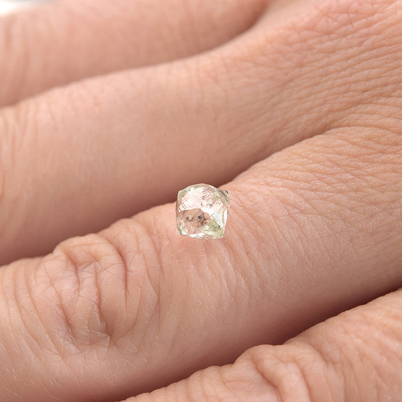 1.06 carat white and waterlike raw diamond dodecahedron