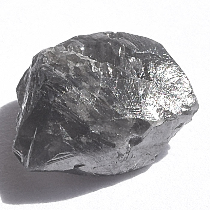 1.5 carat jet black raw diamond triangle