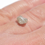 1.36 carat smooth and shiny salt and pepper raw diamond