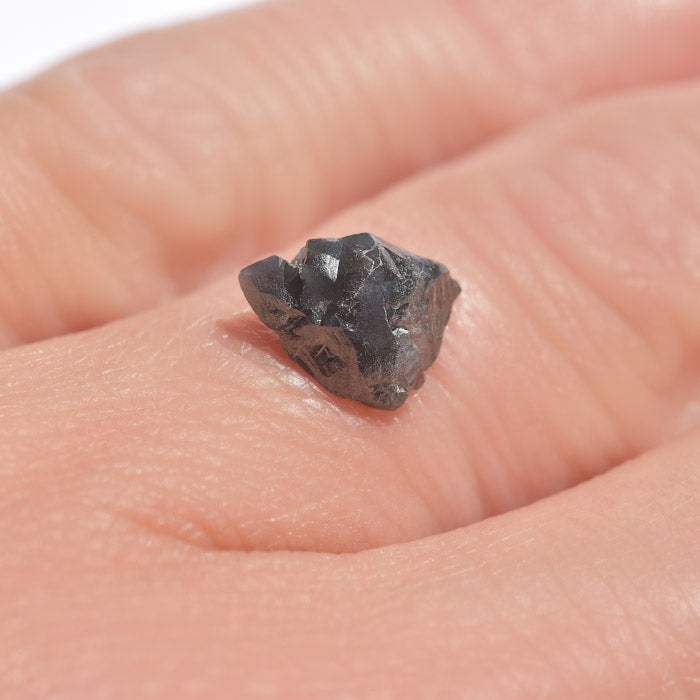 1.55 carat triangular jet black raw diamond