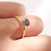 Lagoon green sapphire engagement ring with a minimalist band, 14k yellow gold four prongs and ethically sourced