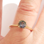 Lagoon green sapphire engagement ring with a minimalist band, 14k yellow gold four prongs and ethically sourced