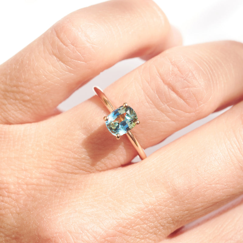 Cushion cut teal sapphire engagement ring in rose gold