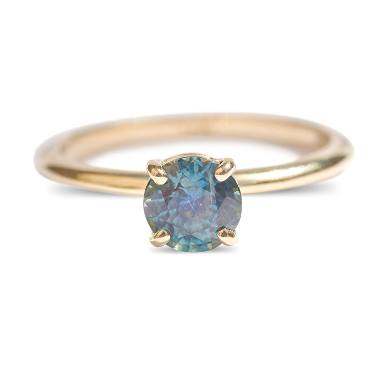 Montana sapphire teal sapphire engagement ring in a delicate band 14k yellow gold size 6 and ready to ship. Ethically sourced from Montana USA.