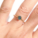 Montana sapphire teal sapphire engagement ring in a delicate band 14k yellow gold size 6 and ready to ship. Ethically sourced from Montana USA.