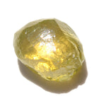 1.09 carat olive green freeform shaped raw diamond