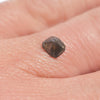 0.43 carat half octahedron black raw diamond on finger