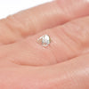 0.32 carat half octahedron white raw diamond on finger