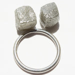 13.78 carat silver gray cubical raw diamond pair